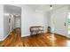 Inviting foyer with hardwood floors and a decorative sunflower inlay at 1920 Daves Creek Trl, Cumming, GA 30041