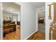 Hallway showing an office space and decorative wall hanging at 1920 Daves Creek Trl, Cumming, GA 30041