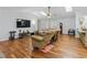 Open living room with hardwood floors, lots of space, and vaulted ceilings at 1920 Daves Creek Trl, Cumming, GA 30041
