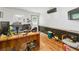 Modern office with hardwood floors, natural light, and a wooden desk at 1920 Daves Creek Trl, Cumming, GA 30041