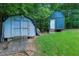 Outdoor storage sheds providing functional space for tools and lawn equipment at 1920 Daves Creek Trl, Cumming, GA 30041