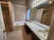 Bathroom with double sinks, shower, and bathtub at 2527 Plymouth Way, Conyers, GA 30013