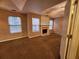 Bedroom features a fireplace and neutral carpet at 2527 Plymouth Way, Conyers, GA 30013