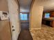 Welcoming entryway showcasing tile flooring, access to the dining area, and a view into the kitchen at 2527 Plymouth Way, Conyers, GA 30013