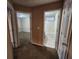 Hallway leading to bedroom and bathroom, showcasing the home's layout and neutral color scheme at 2527 Plymouth Way, Conyers, GA 30013
