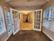 Sunroom with glass doors and multiple windows provides ample natural light at 2527 Plymouth Way, Conyers, GA 30013
