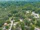 Aerial view showcases a home nestled in a lush, green, wooded neighborhood at 2760 Hembree Ne Rd, Marietta, GA 30062