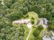 Aerial view of home with a long, winding driveway and plenty of lush greenery at 2760 Hembree Ne Rd, Marietta, GA 30062