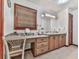 Well-lit bathroom vanity with double sinks and a dedicated makeup counter, providing convenience and style at 2760 Hembree Ne Rd, Marietta, GA 30062