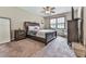 Cozy bedroom featuring a comfortable bed, soft carpet, and lots of natural light at 2760 Hembree Ne Rd, Marietta, GA 30062