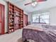 Comfortable bedroom with a cozy bed, large window, and built-in shelves at 2760 Hembree Ne Rd, Marietta, GA 30062