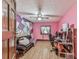 Bright bedroom with creative geometric accent wall, wood floors, and modern furnishings at 2760 Hembree Ne Rd, Marietta, GA 30062