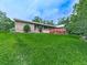 Cozy one story home with a lush green lawn, wooden deck, and mature trees at 2760 Hembree Ne Rd, Marietta, GA 30062