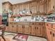 Traditional kitchen with oak cabinets, ample counter space, and built-in appliances, offering functionality at 2760 Hembree Ne Rd, Marietta, GA 30062