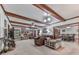 Spacious living room featuring exposed wood beams and a cozy fireplace, perfect for Gathering gatherings at 2760 Hembree Ne Rd, Marietta, GA 30062