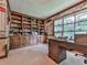 Well-appointed office with custom built-in bookshelves, large window, and executive desk at 2760 Hembree Ne Rd, Marietta, GA 30062