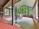 Bright sunroom with multiple windows providing a view of the surrounding greenery at 2760 Hembree Ne Rd, Marietta, GA 30062