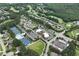 Overhead view of a community showcasing a clubhouse, pool, tennis courts, and lush green spaces at 28 Mcevers Branch Ct, Acworth, GA 30101
