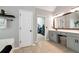 Bright bathroom featuring a double vanity, walk-in closet, and tile flooring at 28 Mcevers Branch Ct, Acworth, GA 30101