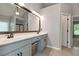 Spacious bathroom with double vanity, a large mirror, and tile flooring at 28 Mcevers Branch Ct, Acworth, GA 30101