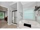 Bright bathroom features a soaking tub, window, and a glass door shower at 28 Mcevers Branch Ct, Acworth, GA 30101