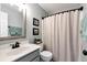 Bathroom featuring a vanity with framed mirror, with a toilet and shower with curtain at 28 Mcevers Branch Ct, Acworth, GA 30101