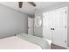 Bright bedroom with white trim, gray walls, plush carpet, and fresh white bedding at 28 Mcevers Branch Ct, Acworth, GA 30101