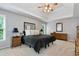 Large bedroom featuring a tray ceiling, natural light, and carpet at 28 Mcevers Branch Ct, Acworth, GA 30101