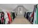 Walk-in closet features ample hanging space and natural light from a window at 28 Mcevers Branch Ct, Acworth, GA 30101