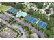 Aerial view shows tennis courts, parking, and a pool for an active and convenient community lifestyle at 28 Mcevers Branch Ct, Acworth, GA 30101