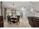 Charming dining room boasts crown molding, a modern light fixture, and natural light at 28 Mcevers Branch Ct, Acworth, GA 30101