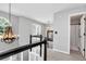 Upstairs hallway with elegant chandelier and an arched window with lots of natural light at 28 Mcevers Branch Ct, Acworth, GA 30101
