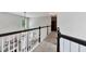 Hallway with dark trim, fireplace, lots of natural light, and an open floorplan design at 28 Mcevers Branch Ct, Acworth, GA 30101
