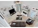 Open living room with fireplace, vaulted ceiling, and ample natural light at 28 Mcevers Branch Ct, Acworth, GA 30101