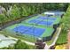 Community tennis courts offer a great recreational amenity with manicured landscaping and lighting at 28 Mcevers Branch Ct, Acworth, GA 30101