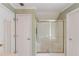 Bathroom with glass shower and dual entrances; door to the left, closet to the right at 3082 Biltmore Woods Dr, Buford, GA 30519