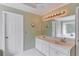 Bathroom with double sink vanity, ample counter space, and soaking tub at 3082 Biltmore Woods Dr, Buford, GA 30519