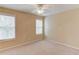 Carpeted bedroom with natural light from two windows, a ceiling fan, and neutral paint at 3082 Biltmore Woods Dr, Buford, GA 30519