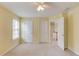 Carpeted bedroom with natural light from a window, a ceiling fan, and neutral paint at 3082 Biltmore Woods Dr, Buford, GA 30519