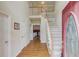 Inviting foyer with hardwood floors, staircase, and views into the adjoining rooms at 3082 Biltmore Woods Dr, Buford, GA 30519