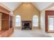 Spacious living room with high ceilings, fireplace, and large windows at 3082 Biltmore Woods Dr, Buford, GA 30519