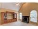 Cozy living room with vaulted ceilings, fireplace and built-in shelving, perfect for relaxing or entertaining at 3082 Biltmore Woods Dr, Buford, GA 30519
