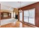 Living room featuring hardwood floors, fireplace, and large window at 3082 Biltmore Woods Dr, Buford, GA 30519