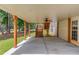 Covered patio with ceiling fan and wooden staircase leading to an elevated deck at 3082 Biltmore Woods Dr, Buford, GA 30519