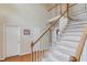 Staircase with white railings and carpet steps leading to the second floor at 3082 Biltmore Woods Dr, Buford, GA 30519