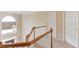 Landing at staircase with hardwood handrail and white wood trim at 3082 Biltmore Woods Dr, Buford, GA 30519