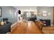 Spacious dining room area with hardwood floors, fireplace, and modern light fixtures at 6355 Queens Rd, Douglasville, GA 30135