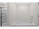 Bathroom with a soaking tub and glass enclosed shower at 8593 Secretariat Drive, Lithonia, GA 30058