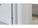 Partial view of bathroom featuring cabinetry and marble counter top, visible from hallway at 8593 Secretariat Drive, Lithonia, GA 30058