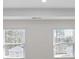 Bright bedroom with large windows bringing in natural light and white walls at 8593 Secretariat Drive, Lithonia, GA 30058